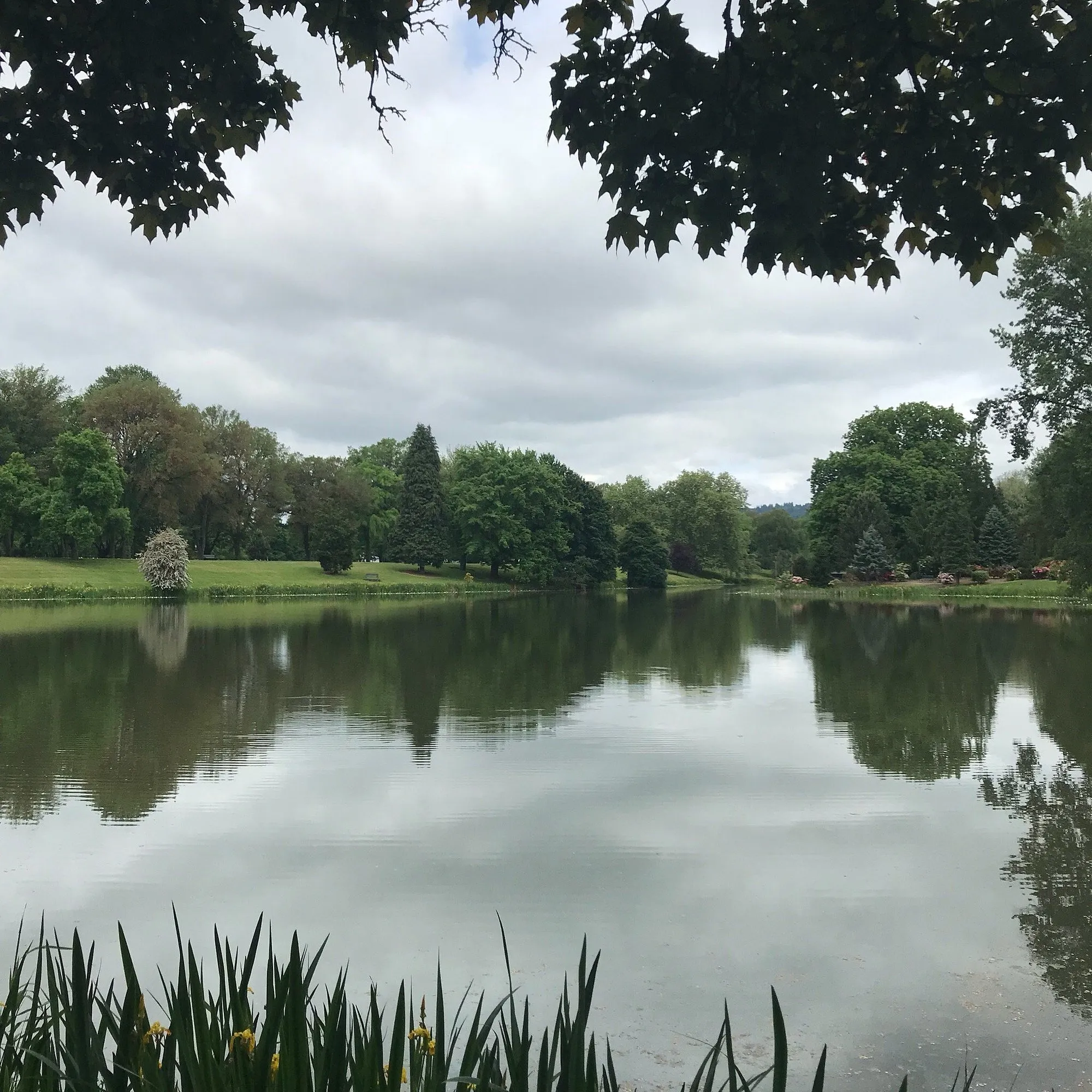 Lake Sacajawea in summer beneath a cloudy sky